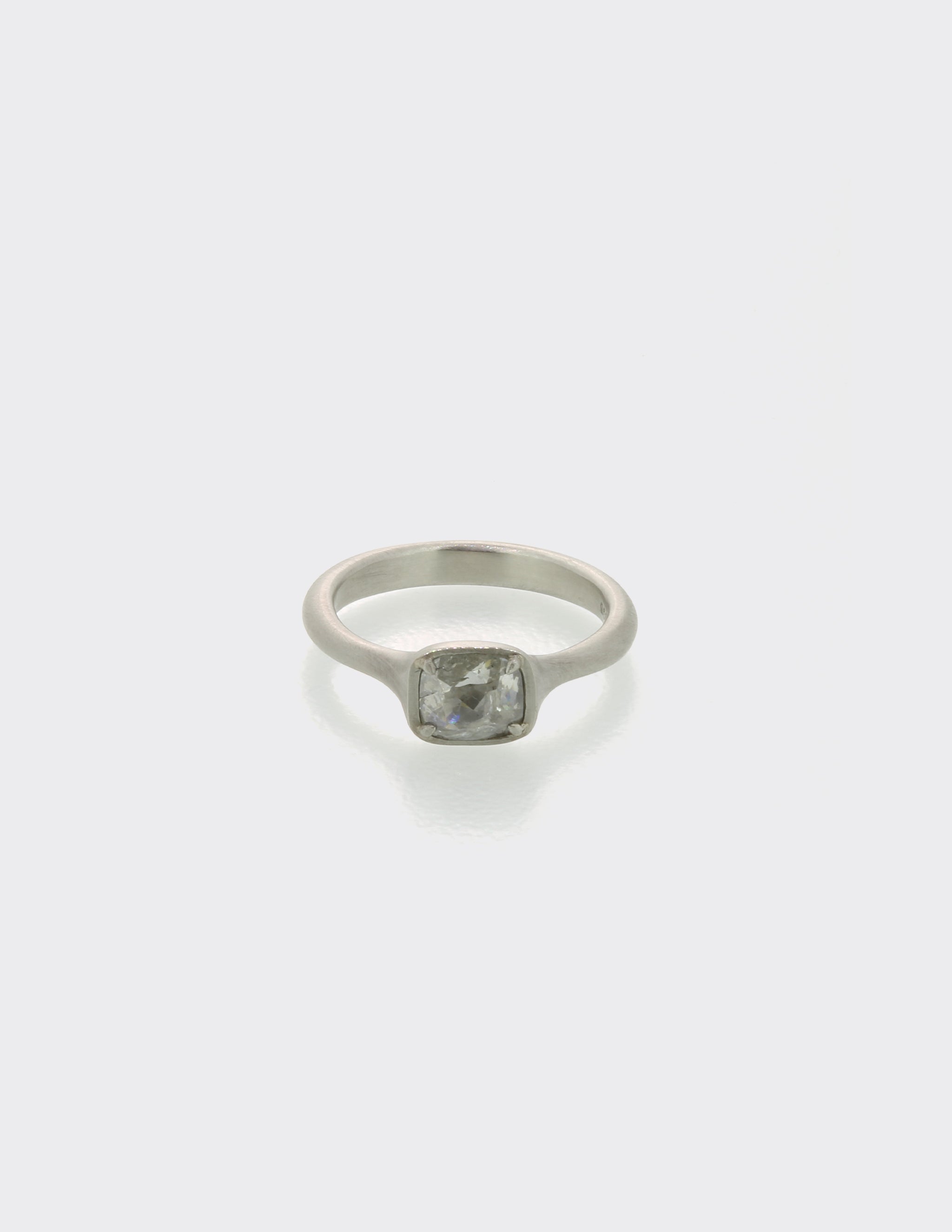 Platinum ring with milky diamond